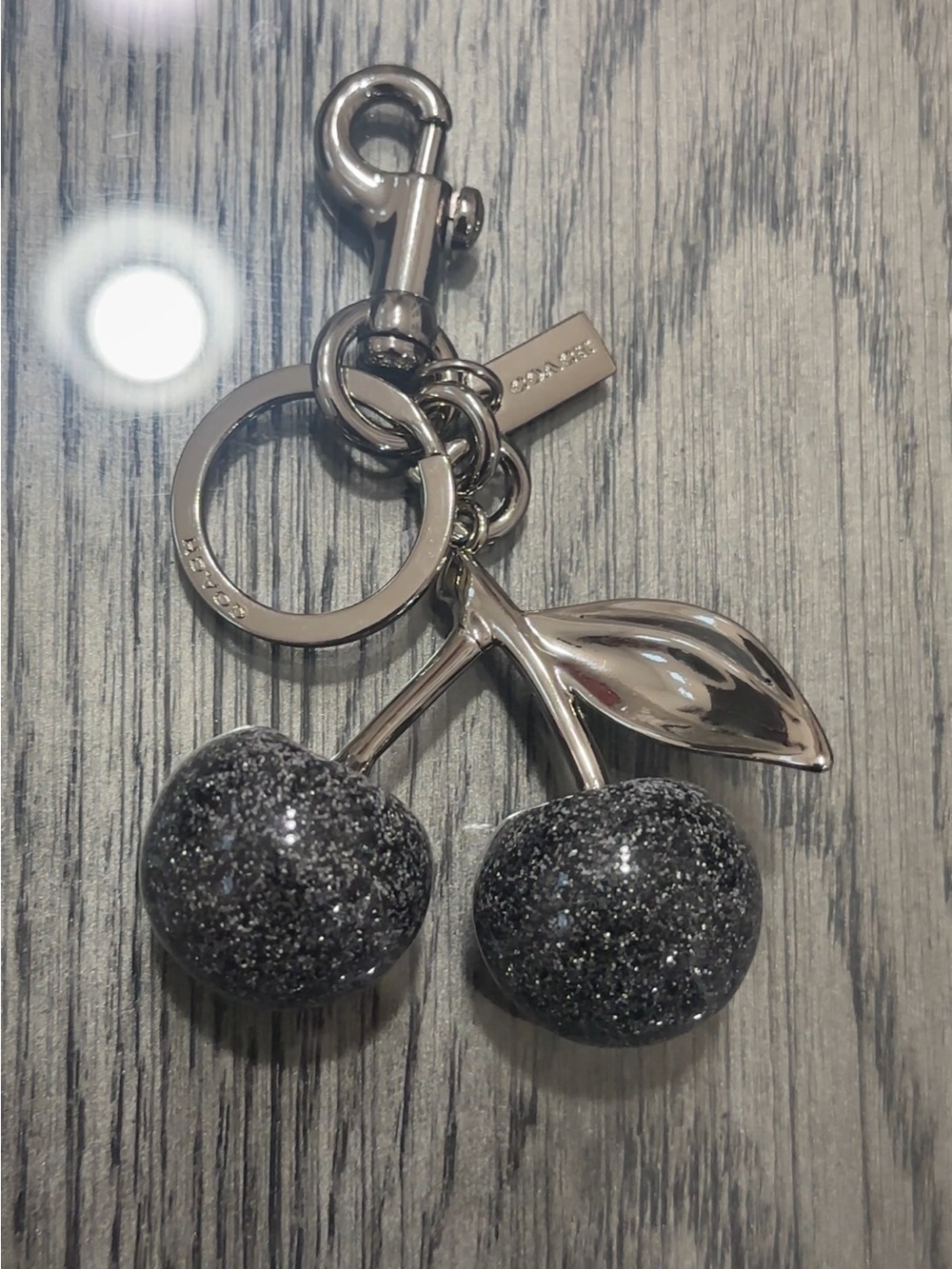 Coach Silver Cherry Keychain with Black Glitter Cherries